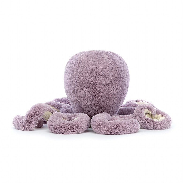 A back view of the purple stuffed octopus