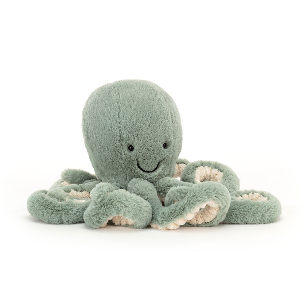 A light green colored stuffed octopus with a smiley face and curly tentacles