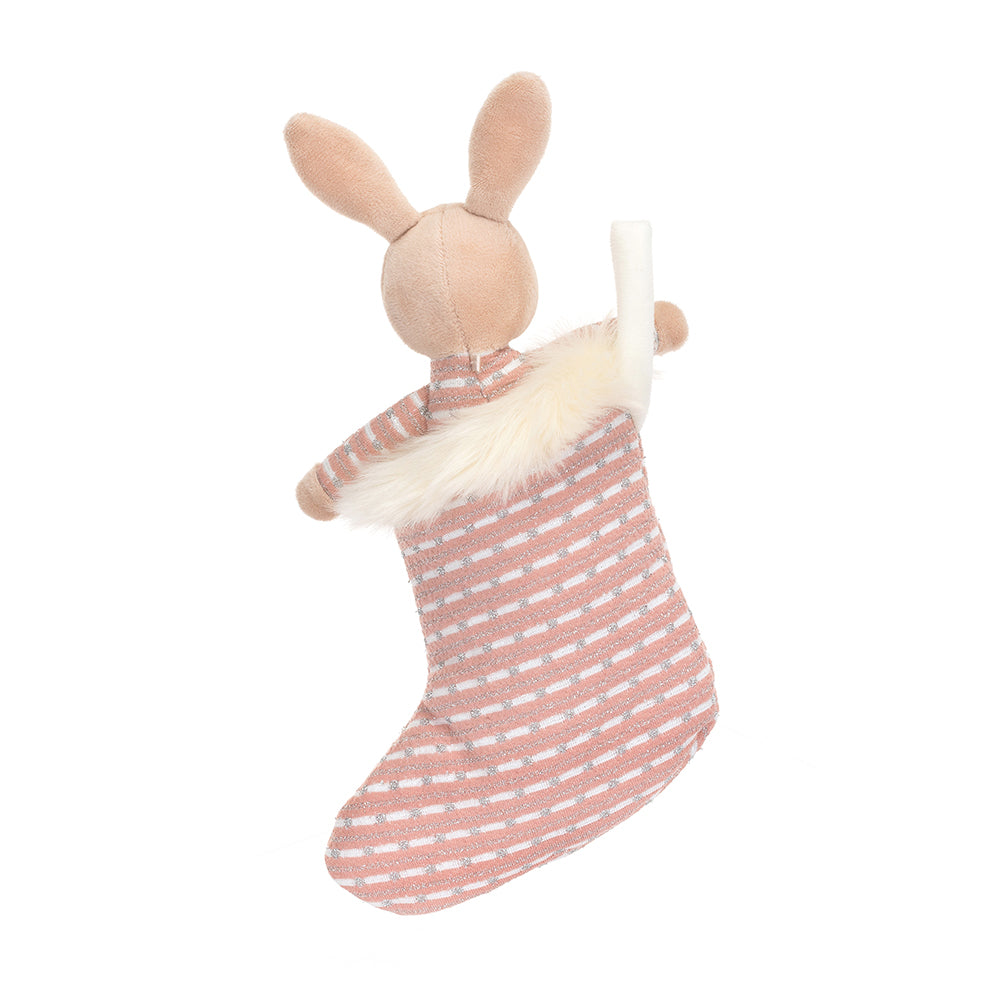 A back view of the stuffed bunny inside the stocking