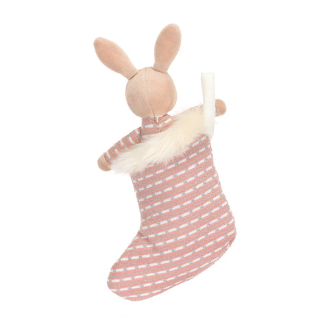 A back view of the stuffed bunny inside the stocking