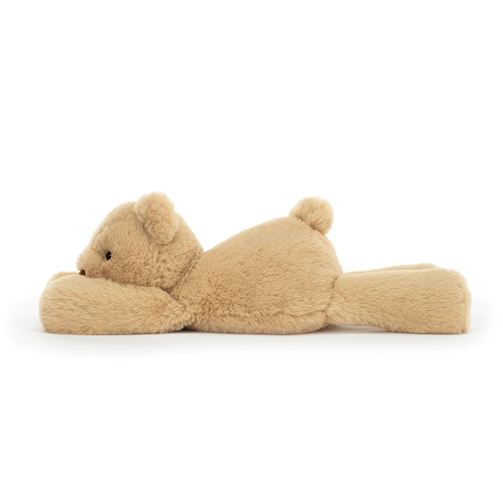 A side view of the floppy teddy bear