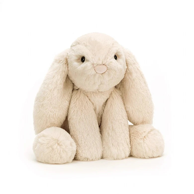 A floppy, oatmeal-colored stuffed bunny