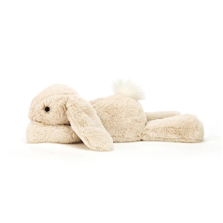 A side view of the floppy stuffed bunny