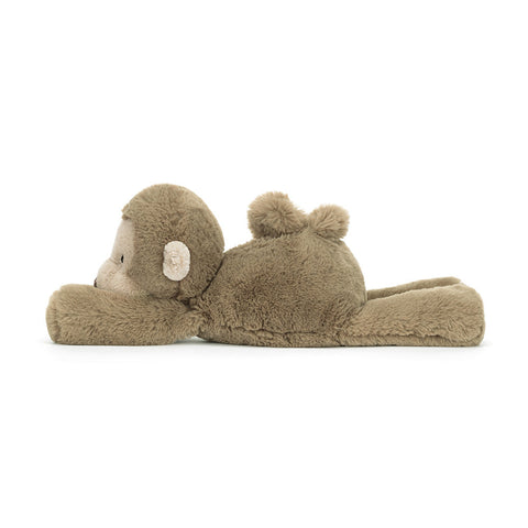 Image shows a side view of the stuffed monkey