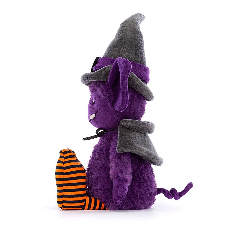 A side view of the purple stuffed gremlin