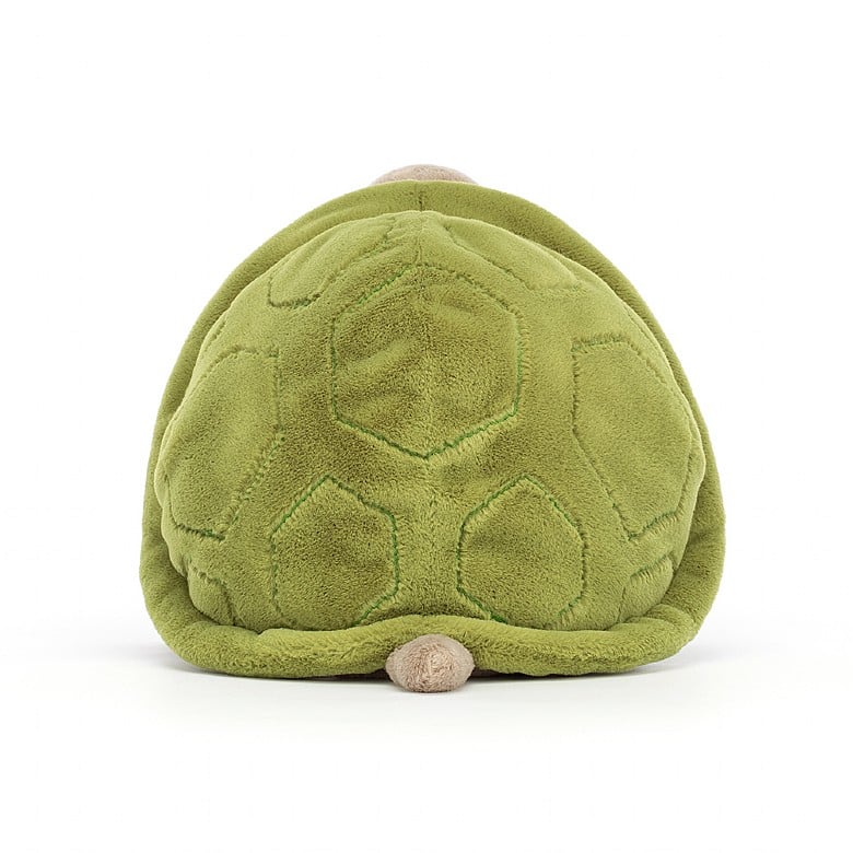 A back view of the seated stuffed turtle