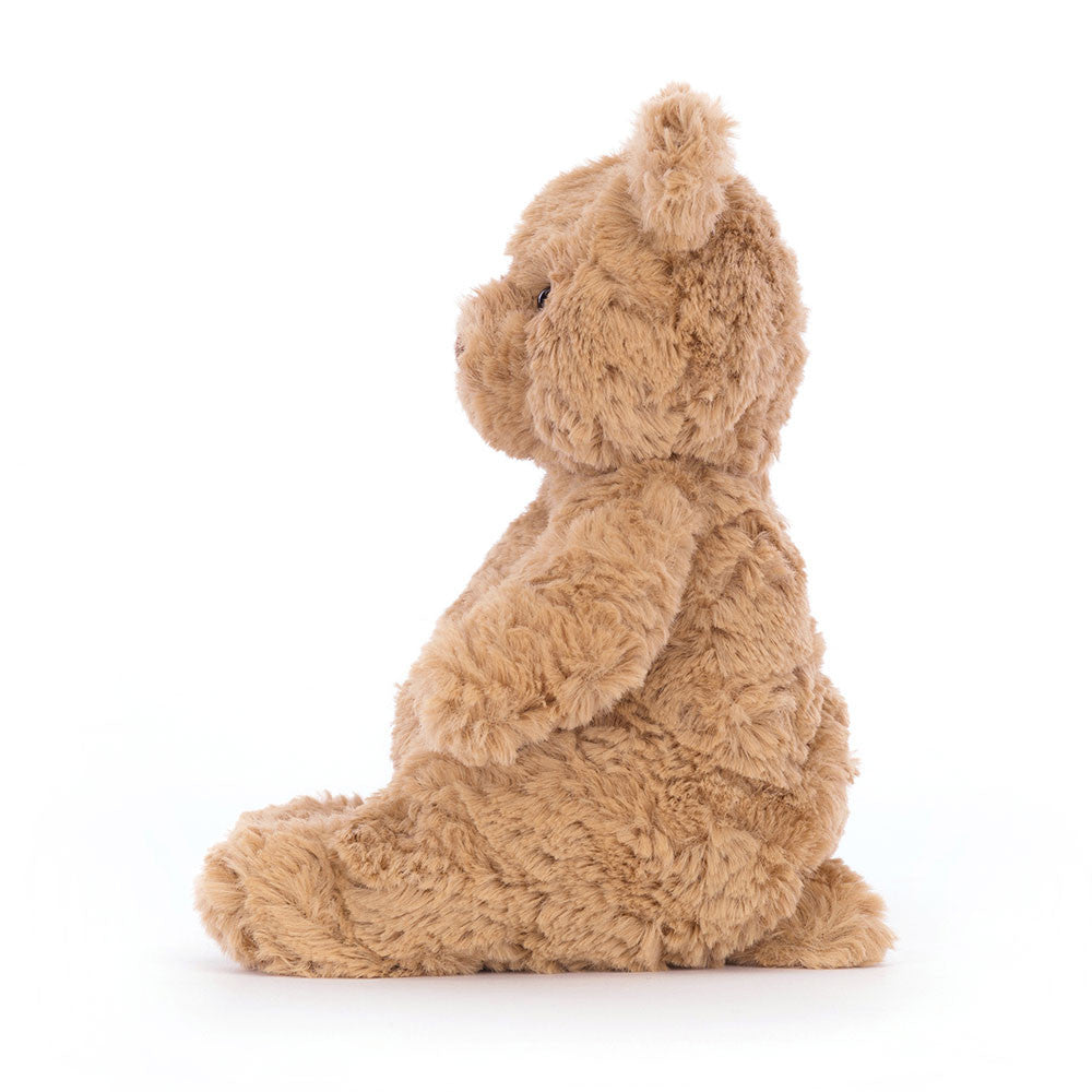 A side view of the small teddy bear