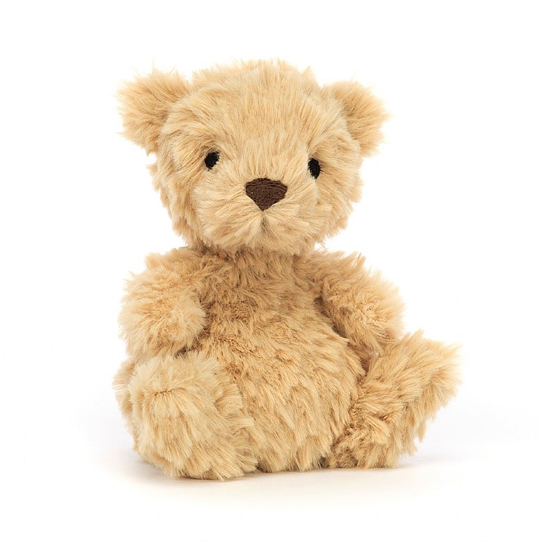 A small, tan, tufty teddy bear