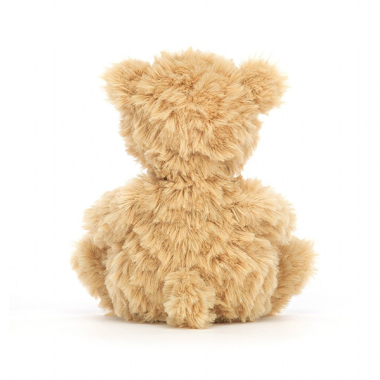 A back view of the tan tufty teddy bear