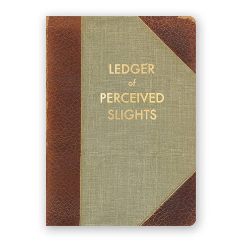 Image shows a brown and green journal. Cover text reads "Ledger of Perceived Slights" in gold.