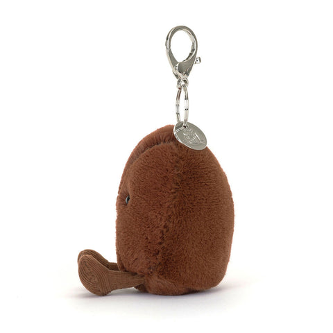 Image shows a side view of the stuffed coffee bean keychain.
