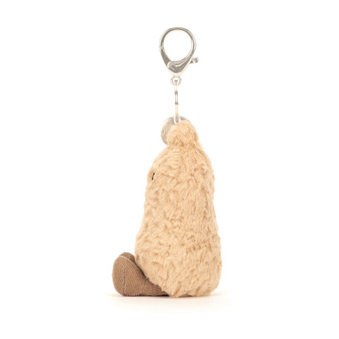 Image shows a side view of the stuffed peanut keychain