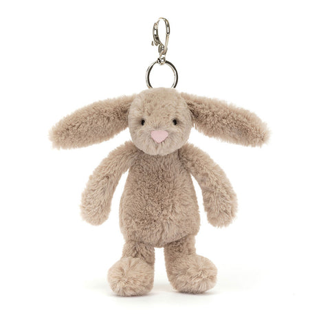 Image shows a beige stuffed bunny hanging from a silver metal keychain clip