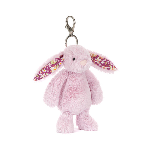 Pink bunny keychain with floral ears on a white background