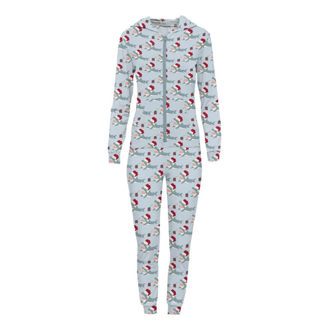 A women's fitted jumpsuit with a light blue background and sharks wearing Santa hats. The sharks are reaching for gifts.