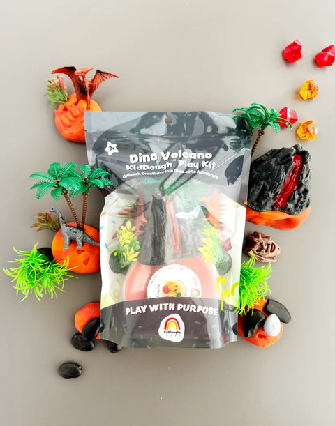 Image shows the product package with all of the playdough accessories scattered around the outside