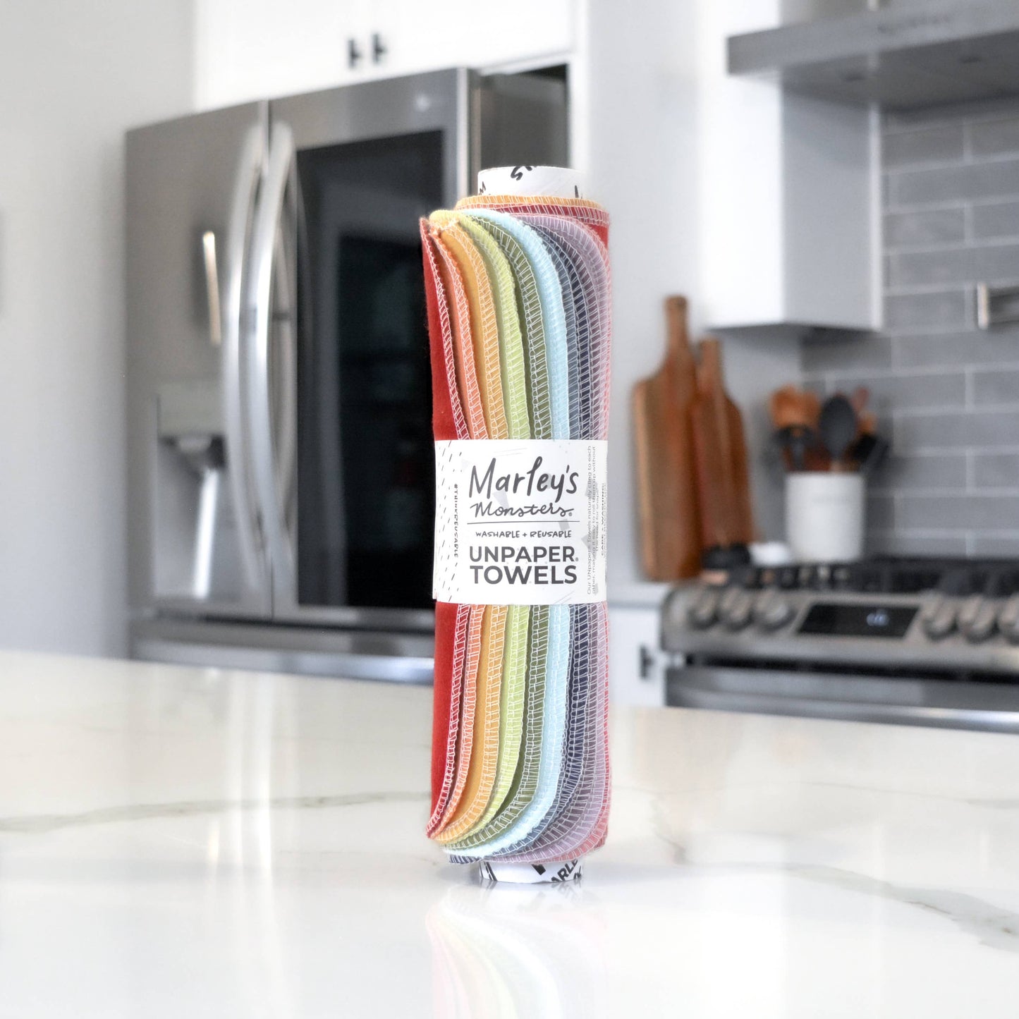 A roll of fabric "unpaper" towels in muted rainbow colors