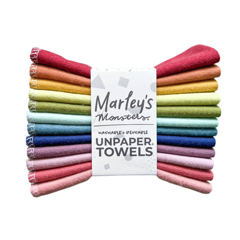 Image shows a 12 pack of fabric towels called "unpaper towels" in muted rainbow colors