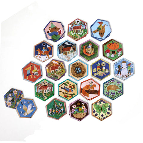 Image shows the hexagon-shaped tiles for the matching game. They are largely woodland themed.