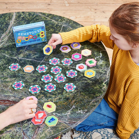 Image shows an adult and a child playing the matching game