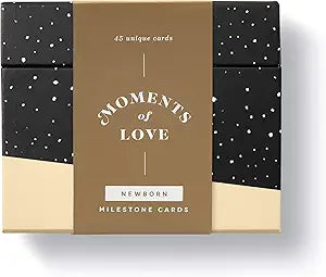 Image shows a black and white box for the Moments of Love Newborn Milestone Cards