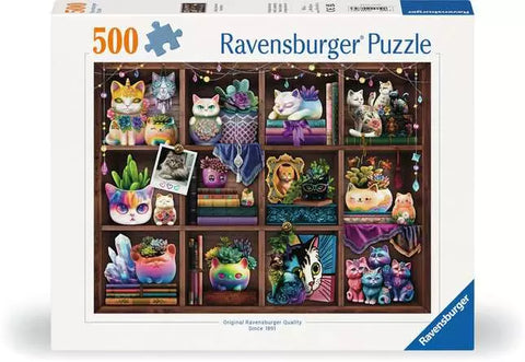 Image shows a box for a 500 piece puzzle. Cats, books, and succulents sit in wooden cubbies.