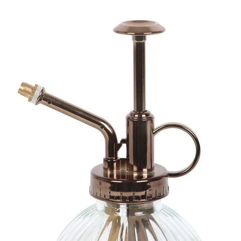 Image shows a close-up view of the metal part of the mister