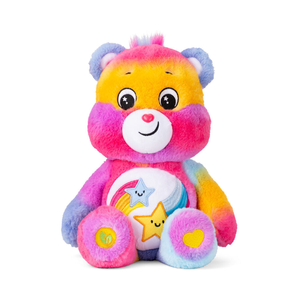 Image shows a brightly colored tie dye Care Bear with two shooting stars on its belly.