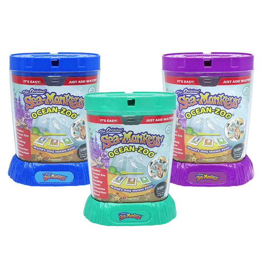 Image shows three packages for ocean zoo Sea Monkeys. One is blue, one is teal, and one is purple.