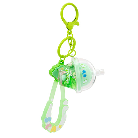 Image shows a green keychain with a boba that reads "Sea world" on the cup.