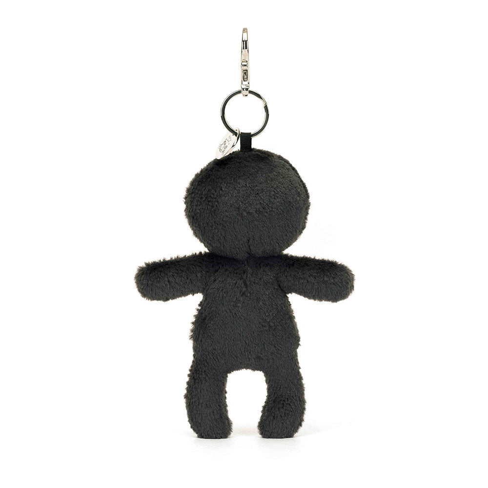 Outline of a stuffed human body hanging from a clip keychain