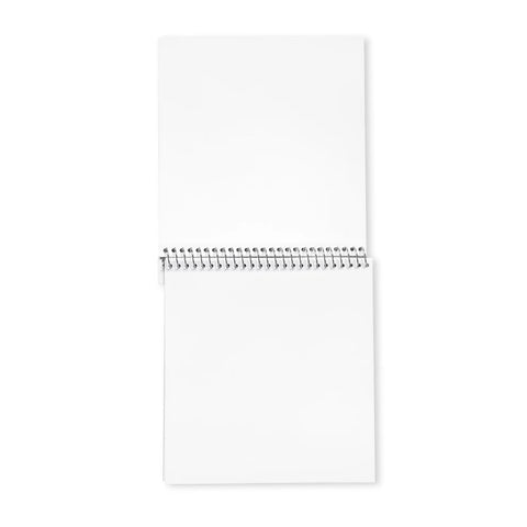 Image shows the open sketchbook. The pages are white and square.