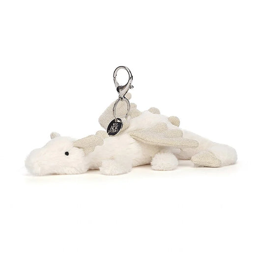 A stuffed white dragon hanging from a clip keychain