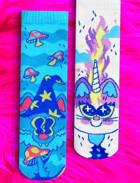 Image shows a pair of mismatched socks. One is a sorcerer cat and one is a unicorn cat.