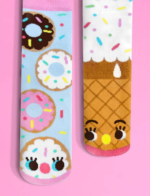 Image shows a pair of mismatched socks. One is donuts with a happy face, one is an ice cream cone with a happy face.