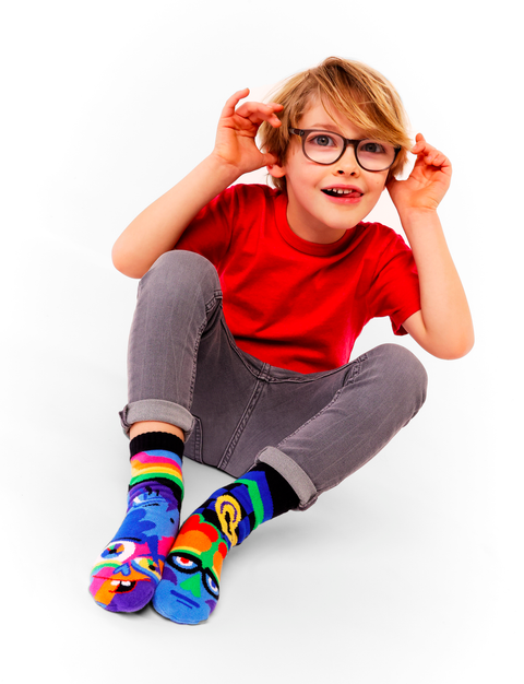 Image shows a young boy wearing the socks
