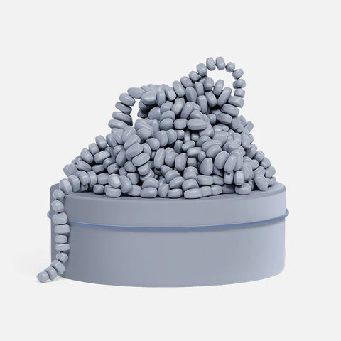 Image shows a slate-colored tin with slated-colored magnetic beads