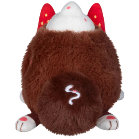A back view of the stuffed cocoa-themed Kitsune. It has white paws and a darker brown tail