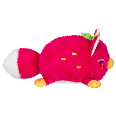 A side view of the fruity kitsune. Its body is round, and you can see the range embroidered seeds.