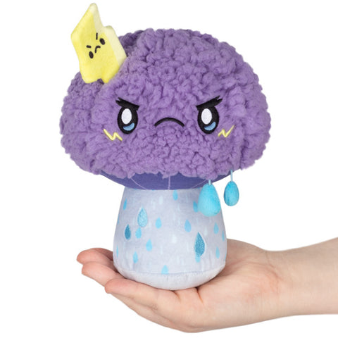 Image shows a purple fuzzy mushroom with a frowning face, raindrops on the base, and a lightning bolt.
