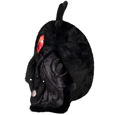 A side view of the plush baby mothman