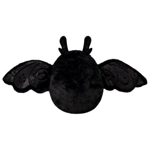 A back view of the plush baby Mothman with his wings open