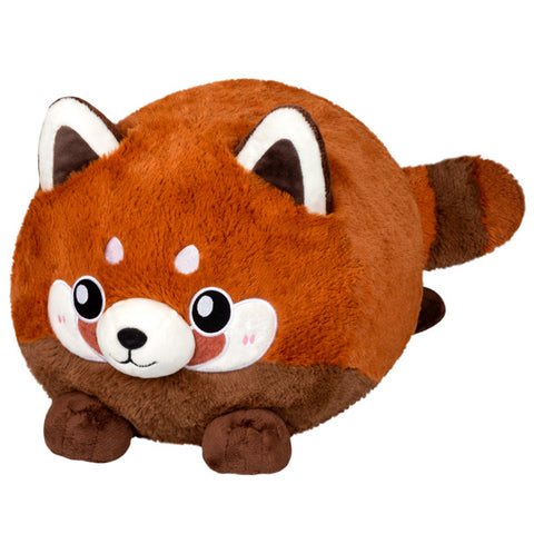 A plush toy resembling a baby red panda with a brown body, white markings around the eyes, and a fluffy tail.