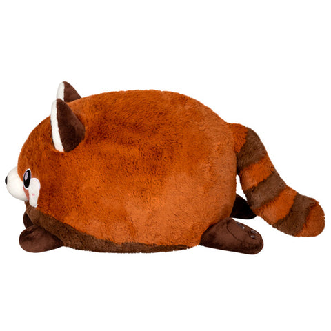 A side view of the plush red panda. Its body is very round.
