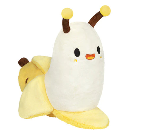 Plush slug in a yellow banana peel on a white background
