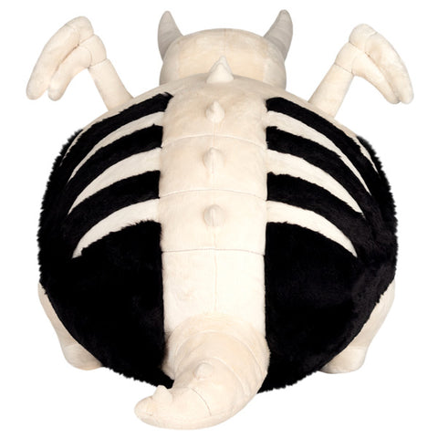 Image shows a back view of the stuffed bone dragon. His ridge and tail are made of bones.