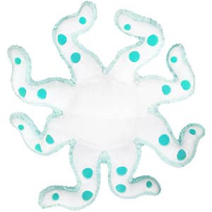 Bottom-up view of the plush octopus. It is white with teal dots.