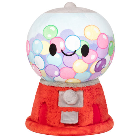 A plush gumball machine with gumball fabric and a red base