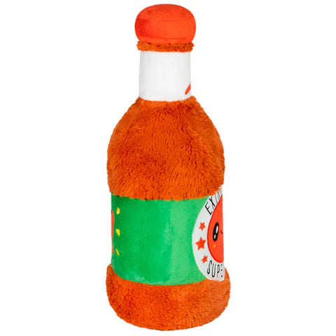 Plush toy shaped like a bottle with orange and green design on a white background