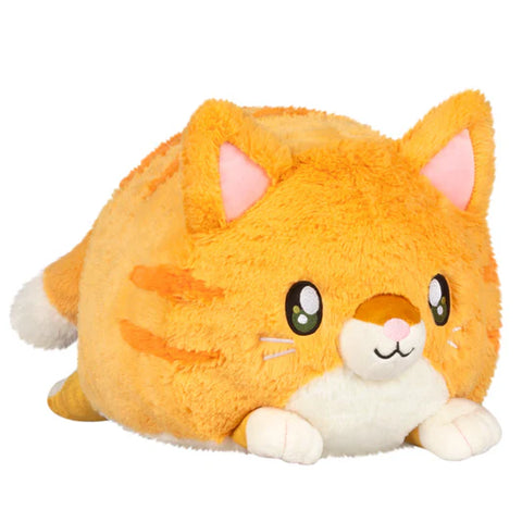 Plush toy cat with orange fur and white paws on a white background